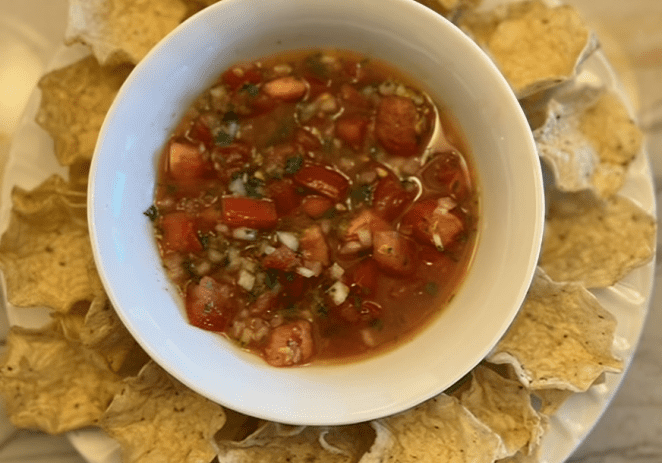 Tomato salsa with tortilla chips.